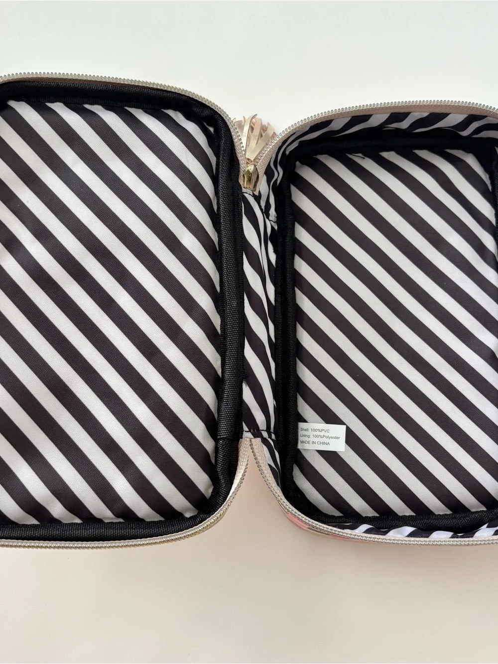 Too Faced pink and gold zip up makeup bag